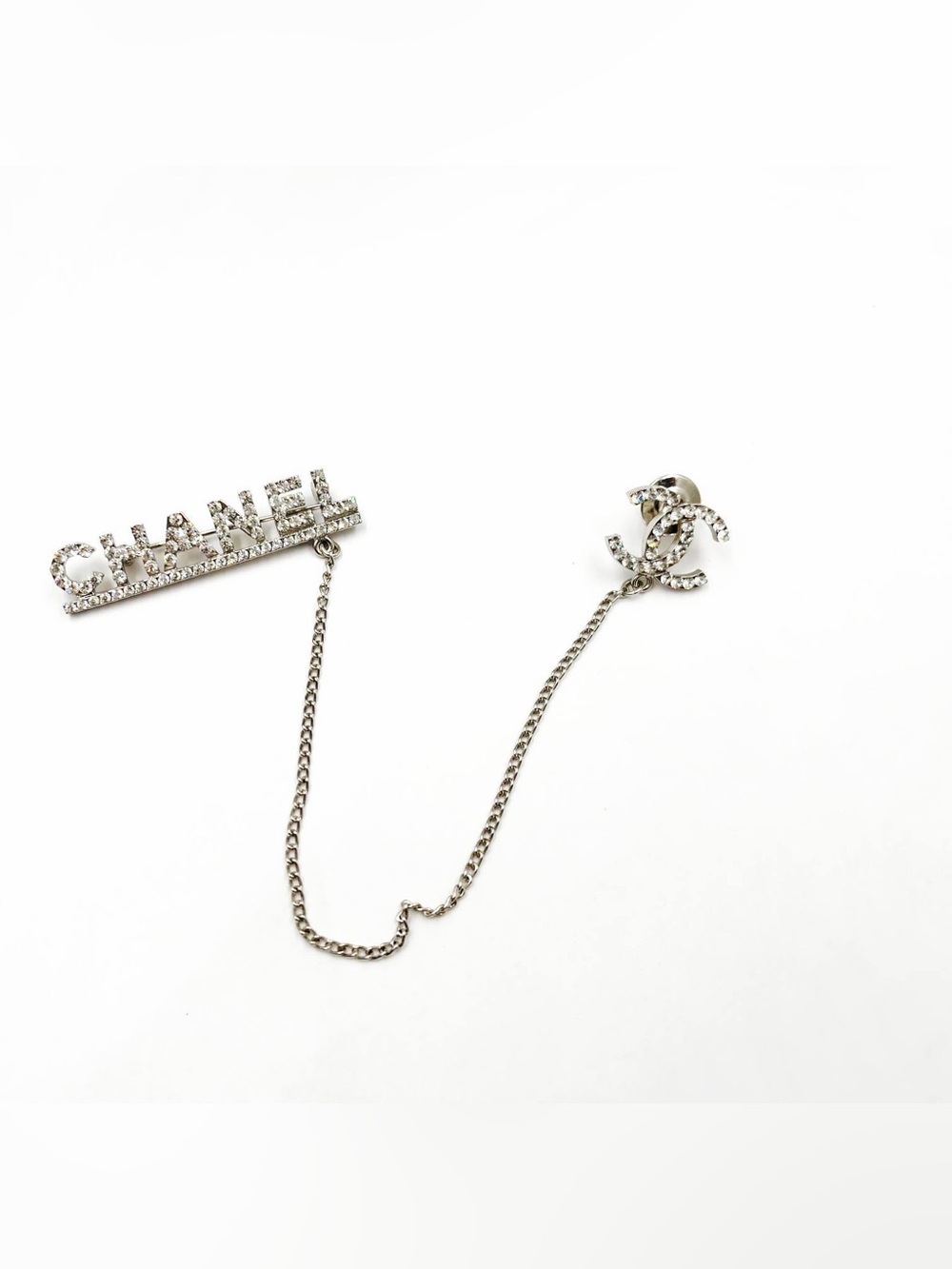 CHANEL Silver Crystal Logo Chain Pin